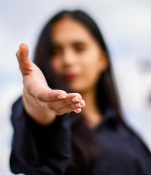 Woman reaching out cropped